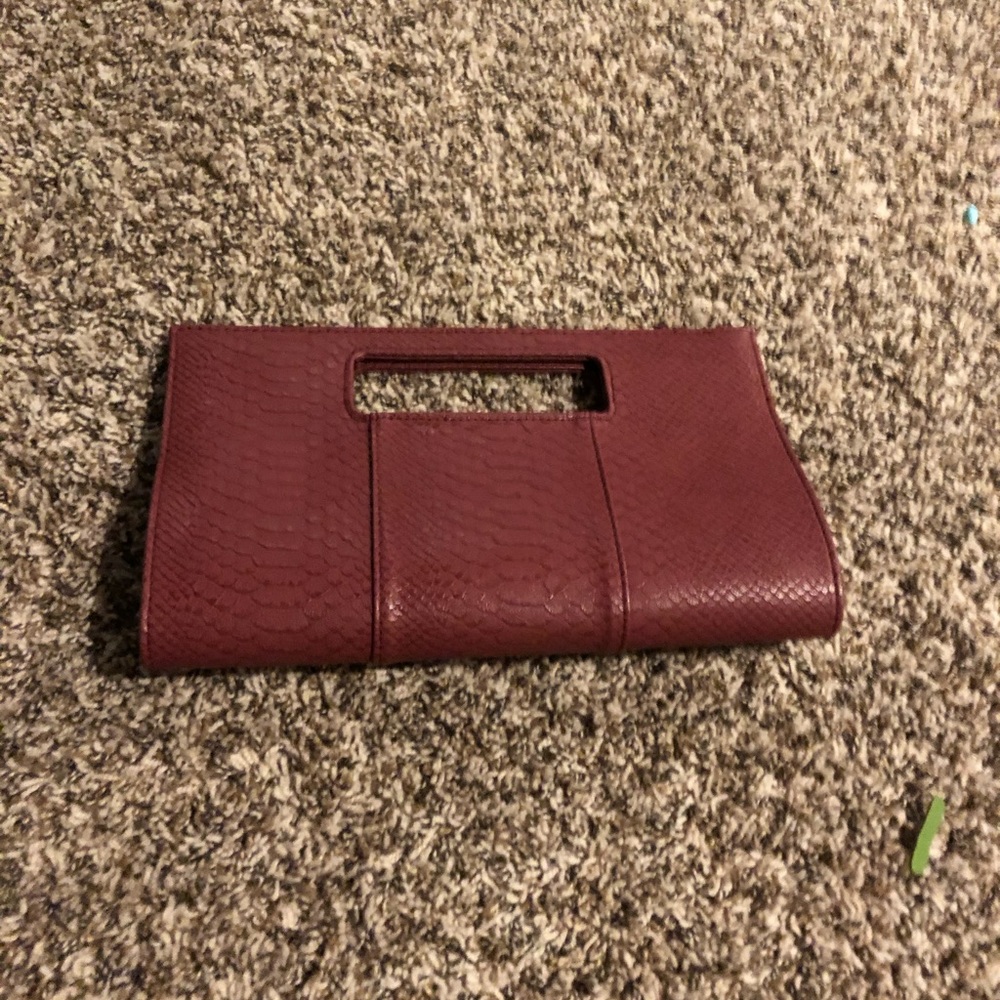 Purple faux-alligator skin magnetic hand held bag